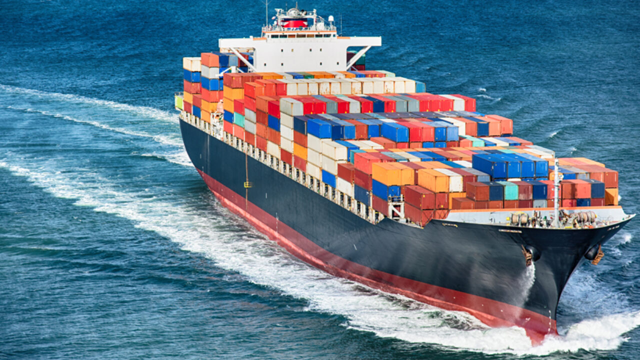 A large cargo container ship out to sea.